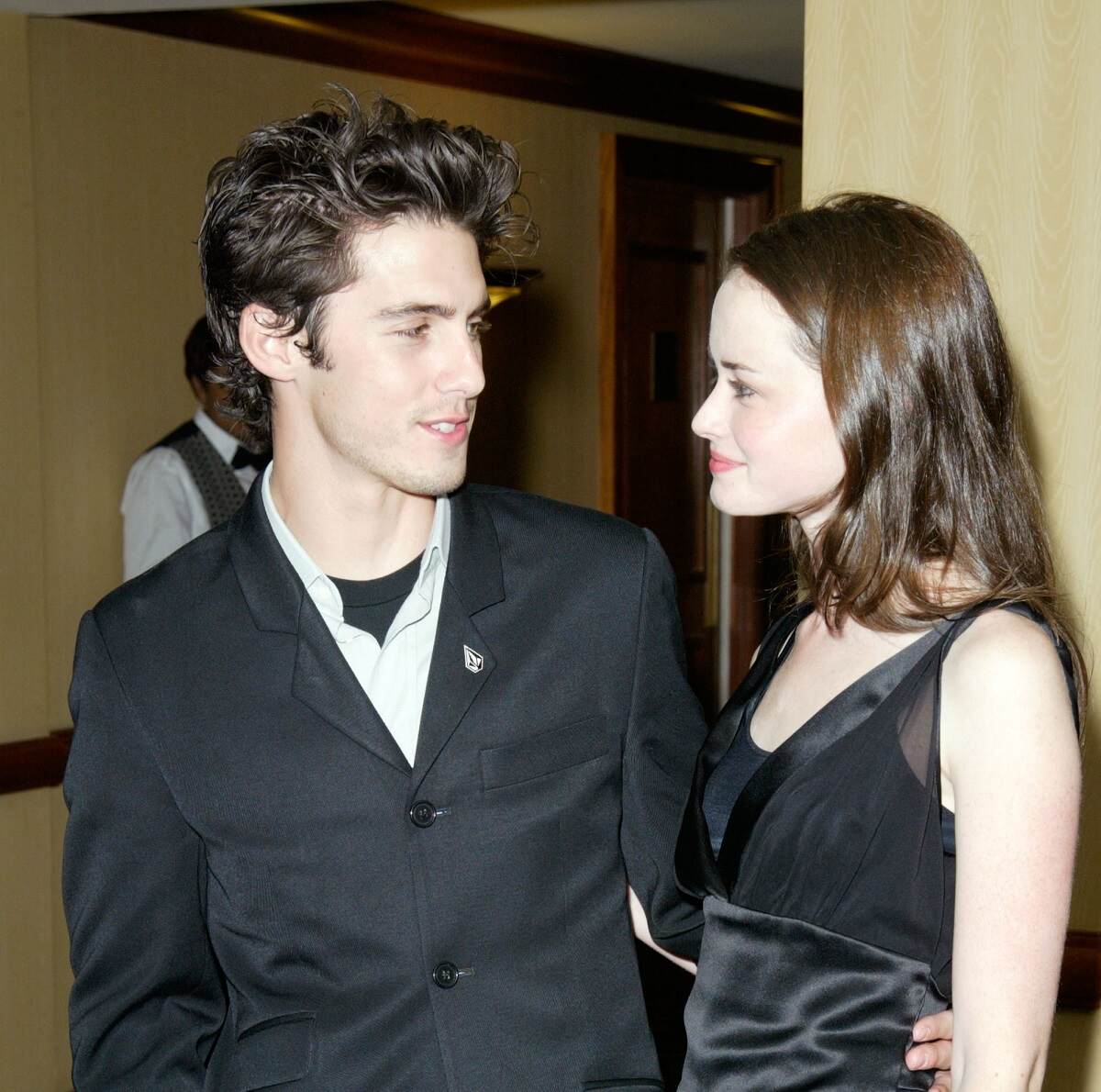 Milo Ventimiglia and Alexis Bledel dressed in black attend the 2003-2004 WB Upfront Previews together. Ventimiglia and Bledel played Jess Mariano and Rory Gilmore in 'Gilmore Girls'