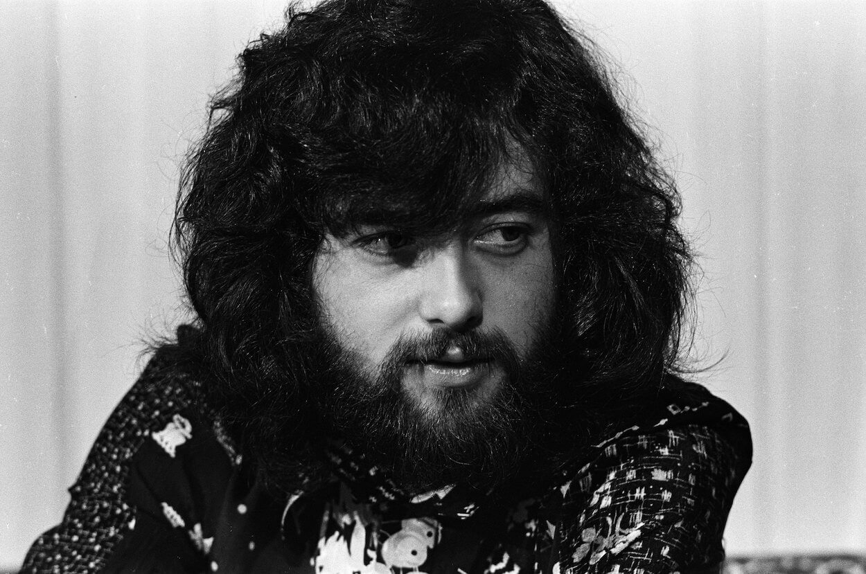 Led Zeppelin guitarist Jimmy Page sports a thick beard while looking off to the side during a 1970 press conference.