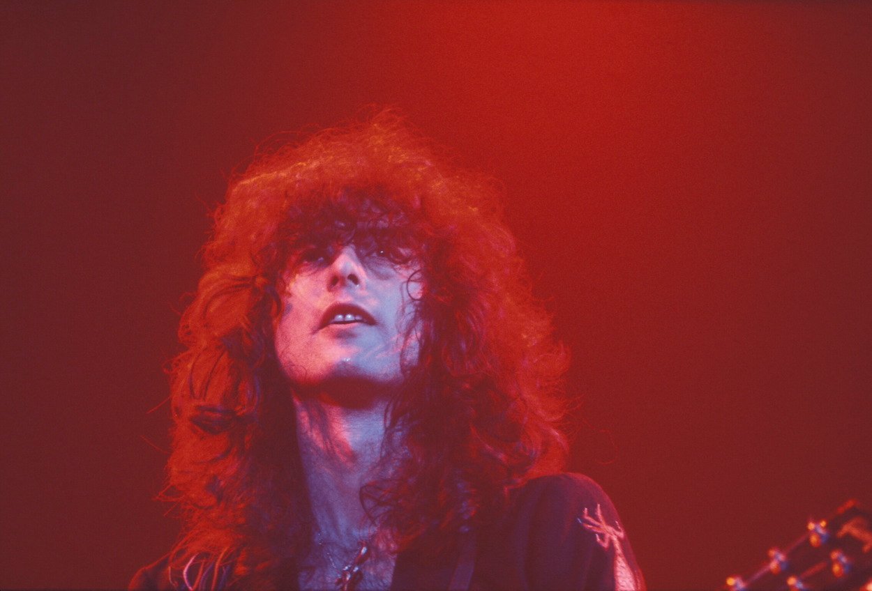 Led Zeppelin guitarist Jimmy Page looks off into the distance during a 1975 concert at Earl's Court in London.