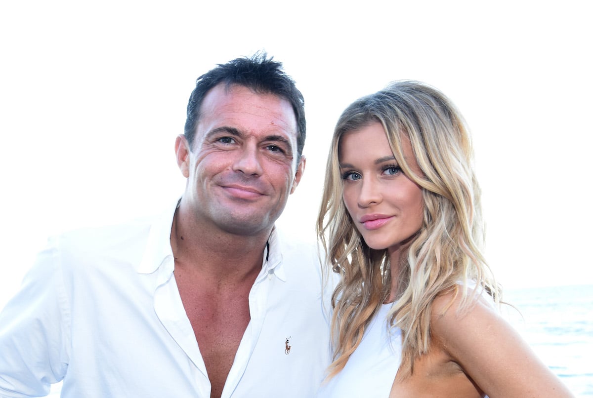 Joanna Krupa and Romain Zago wearing white