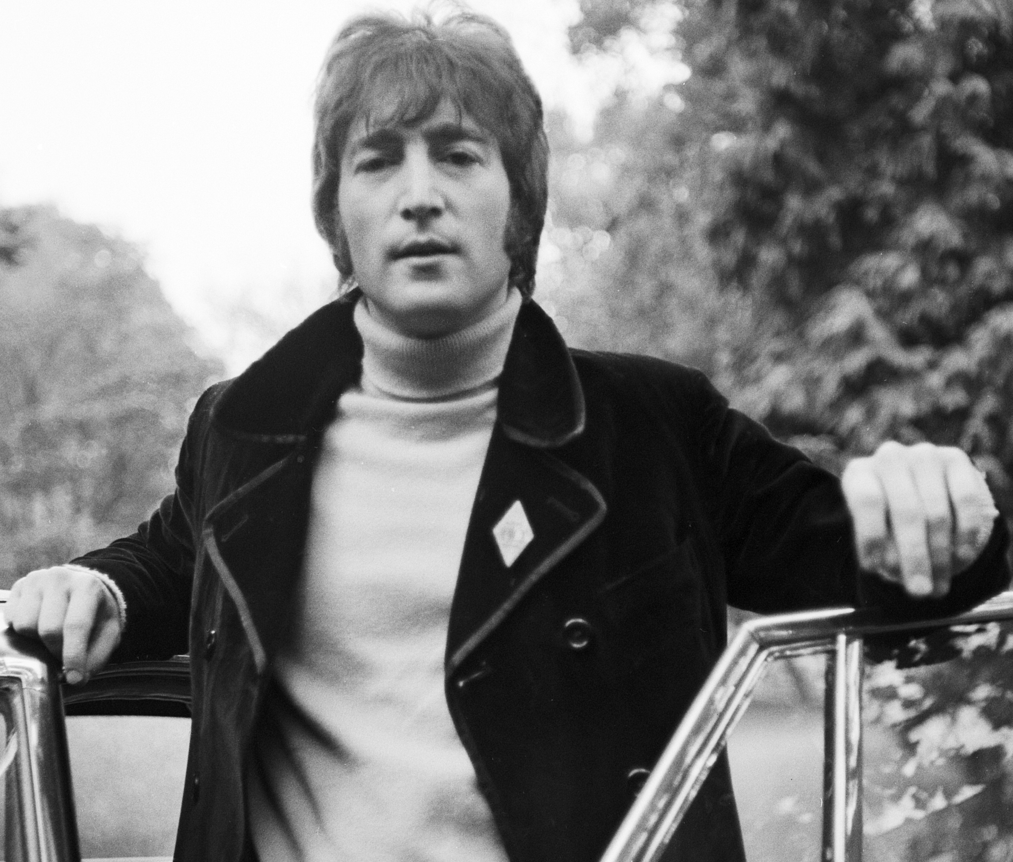"Jealous Guy" singer John Lennon by a car