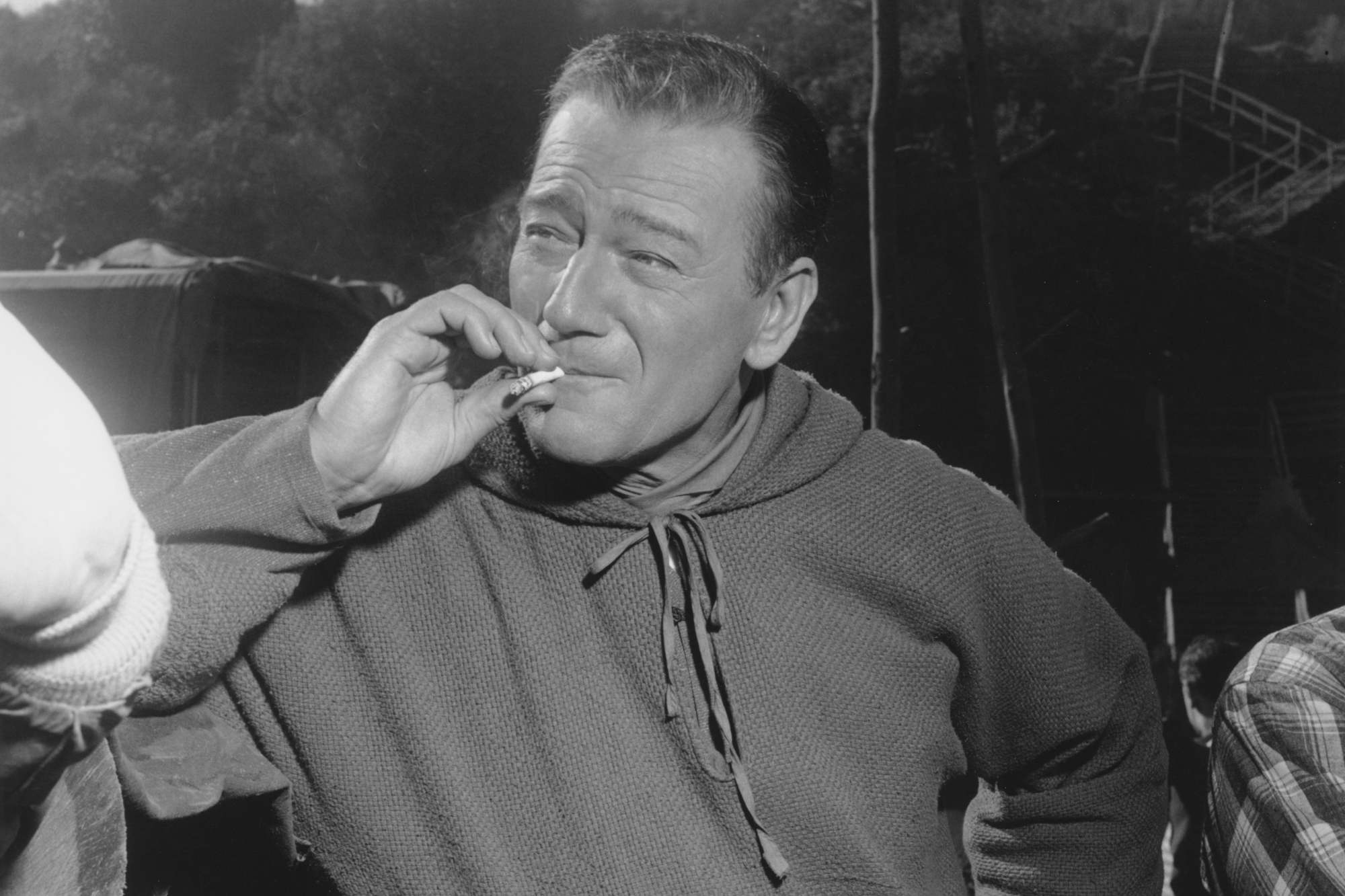 John Wayne, who wasn't a fan of weed. He's smoking a cigarette, while wearing a costume.