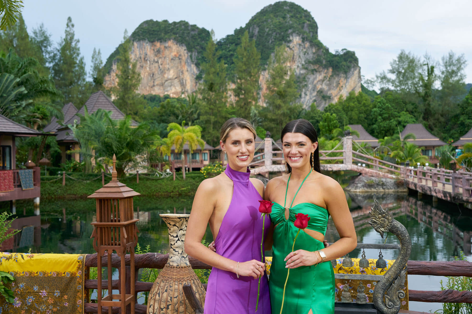 Kaity Biggar and Gabi Elnicki from 'The Bachelor' Season 27 finale standing next to each other in dresses outdoors holding roses