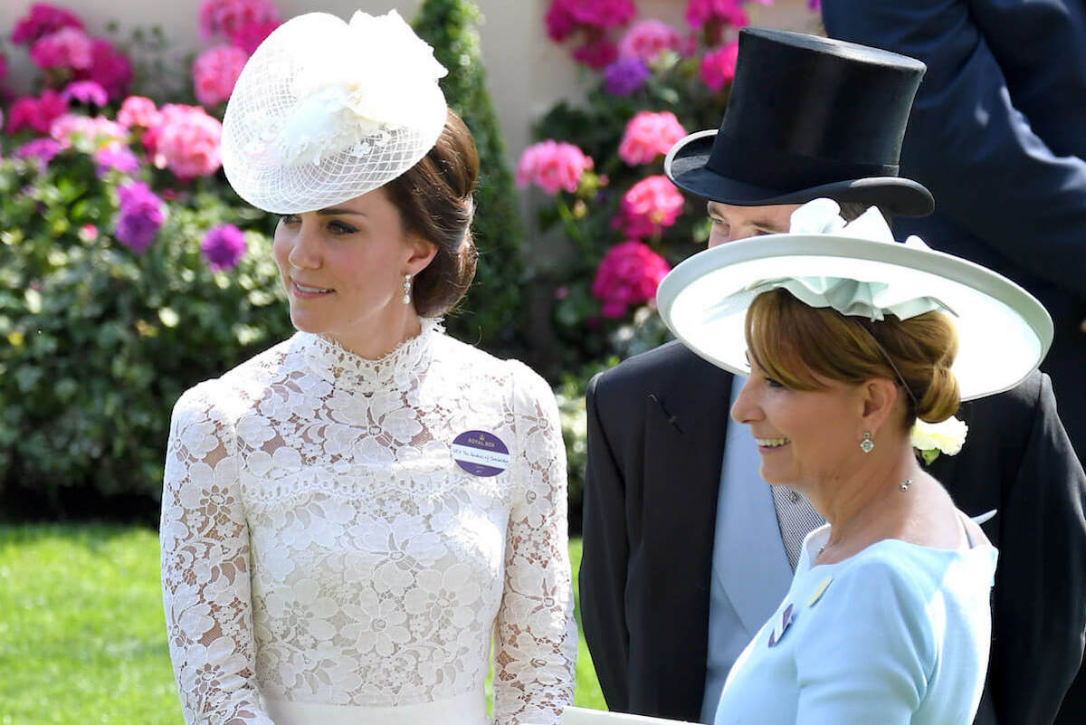 Kate Middleton, whose mother, Carole Middleton, exhibits different body language with compared to other children, stand together