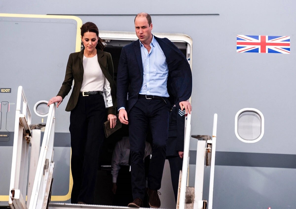 Kate Middleton and Prince William descend from their airplane as they arrive at RAF Akrotiri