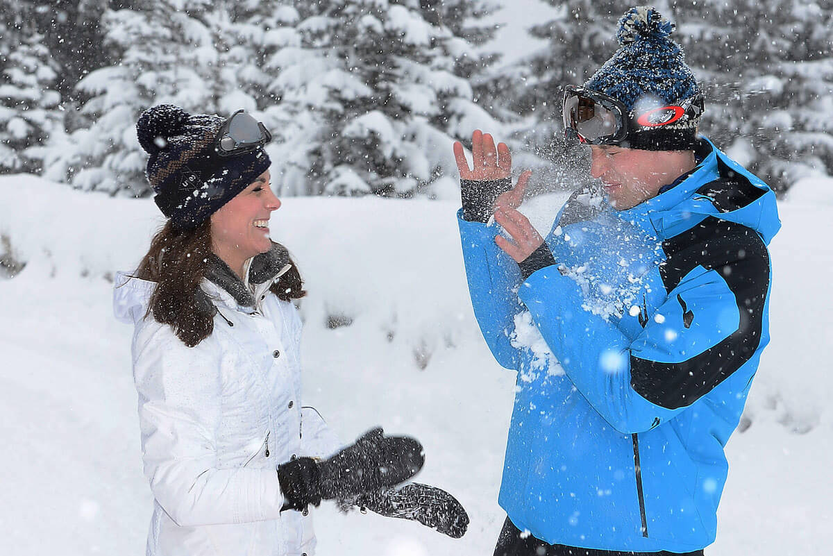 Kate Middleton, whom photographer John Stillwell told to throw a snowball during a 2016 photo op, throws snow at Prince William 