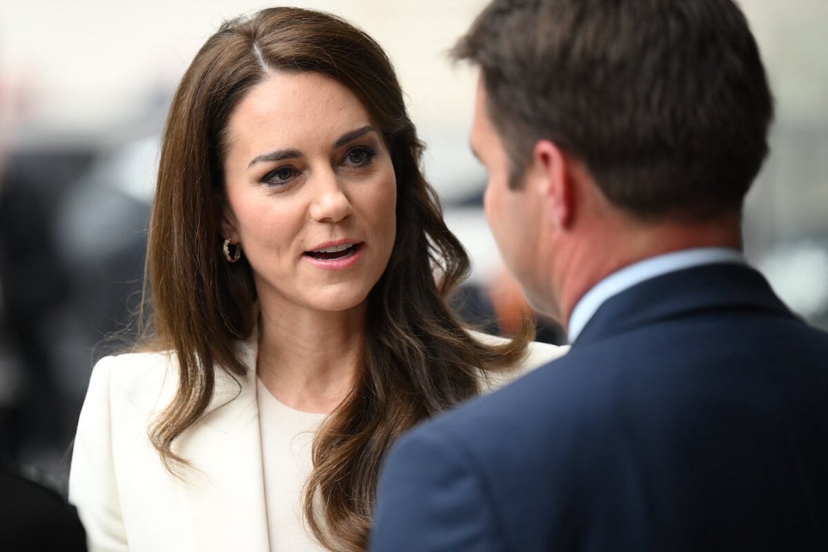 Kate Middleton, whose elbows were a 'giveaway' in 'boardroom' photo, looks on