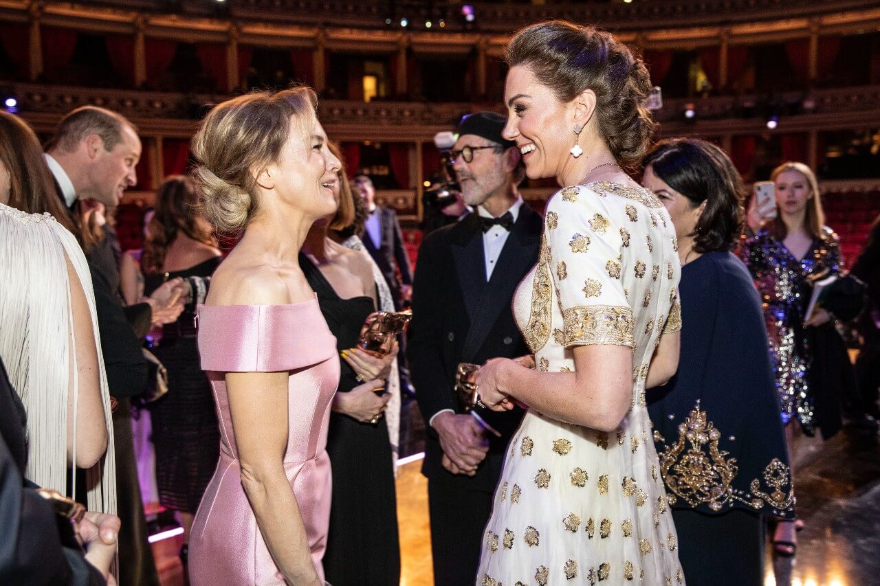 Kate Middleton talks to Renee Zellweger during an event.