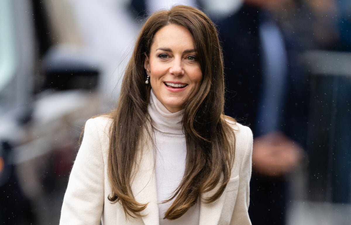 Kate Middleton wearing white and smiling