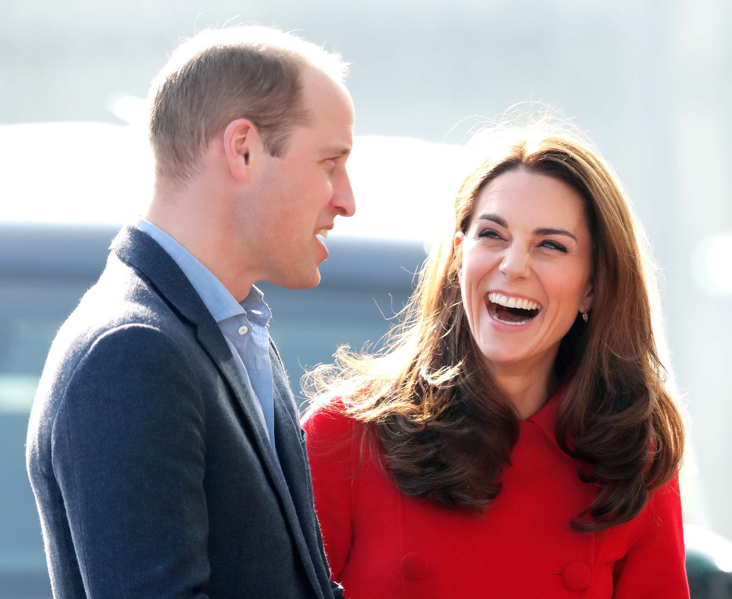 Kate laughs while talking to William during a 2019 royal engagement.