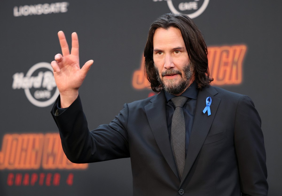 Keanu Reeves waves at the 'John Wick: Chapter 4' premiere