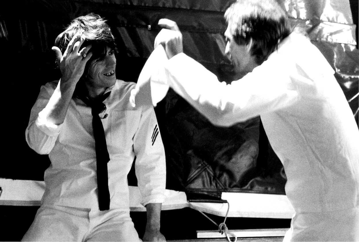 Keith Richards (left) and Charlie Watts of The Rolling Stones wear white suits while filming the 'It's Only Rock n' Roll (But I Like It)' video in 1974.