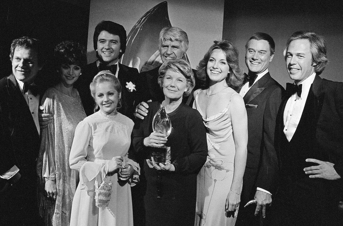 The Cast of "Dallas" holds an award from the 1980 People's Choice Awards