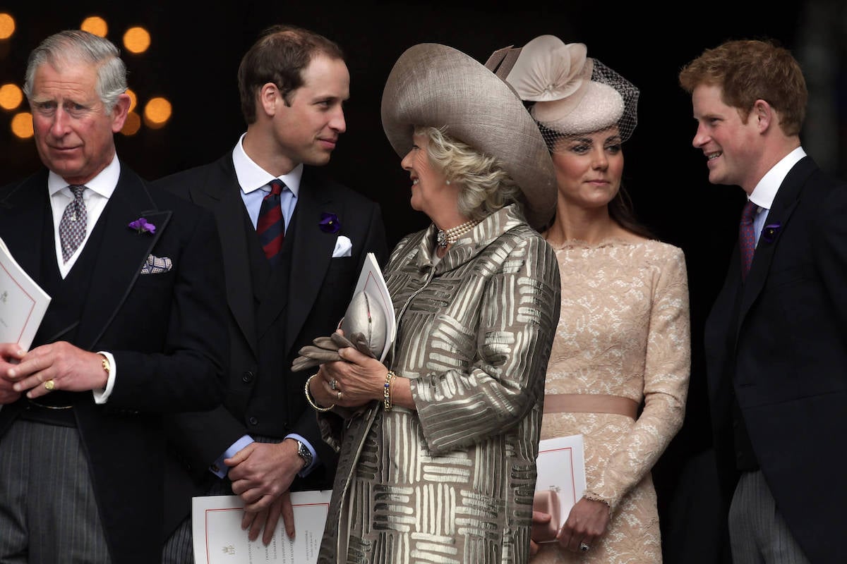 King Charles, Prince William, Camilla Parker Bowles, and Kate Middleton, who didn't attend Princess Lilibet's christening in what wasn't a 'snub' to Prince Harry and Meghan Markle, stand with Prince Harry