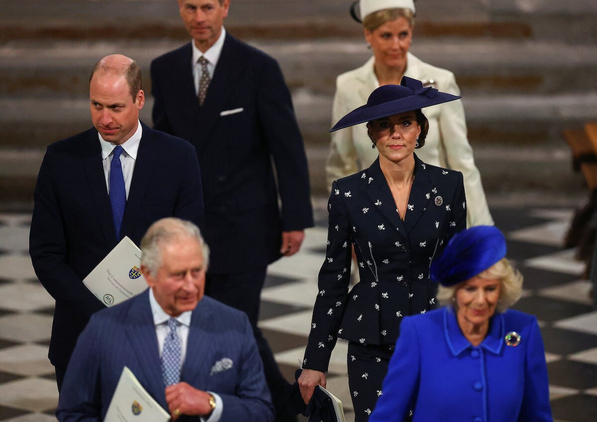 Kate Middleton, whose coronation outfit is predicted not to 'too 'out there,'' walks with other royals