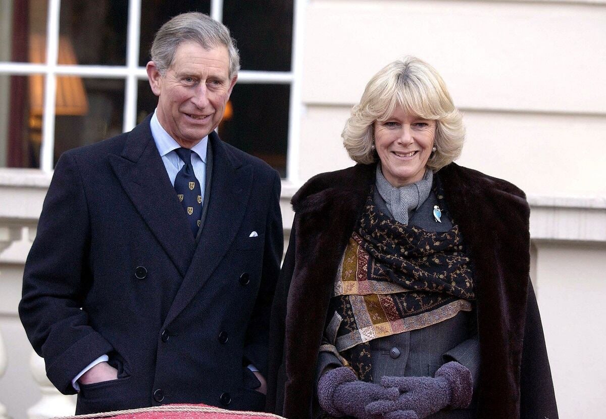 King Charles III and Camila Parker Bowles are seen at an official event together, both dressed in suits