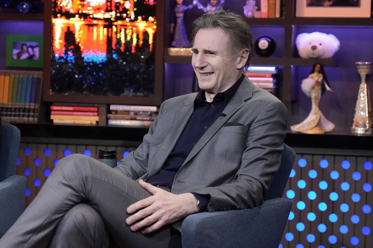 Liam Neeson sits on a chair on the set of Bravo's "Watch What Happens Live"