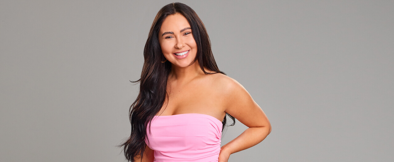 Irina of 'Love Is Blind' Season 4 poses in a pink dress.