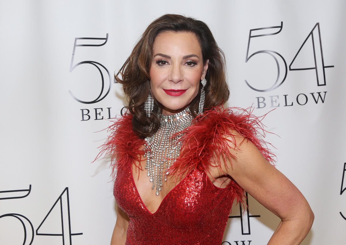 "RHONY" star Luann de Lesseps smiles and poses at an event.