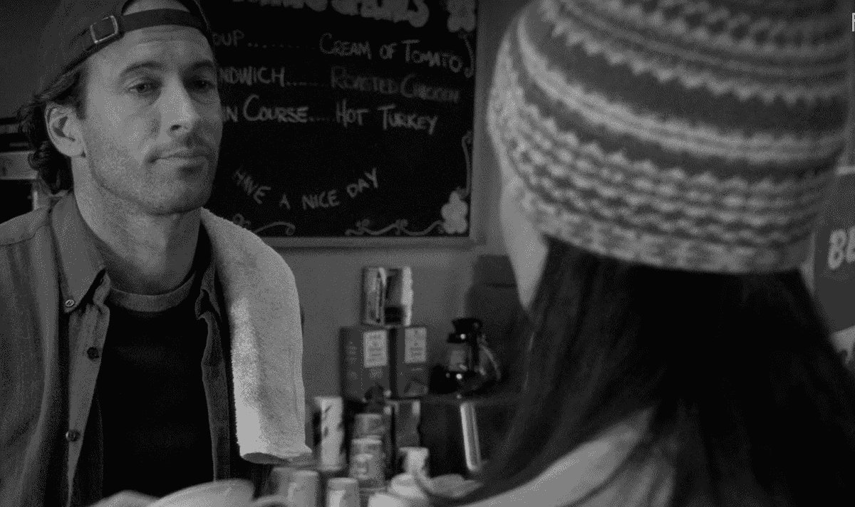 Luke Danes and Lorelai Gilmore interact during the opening scene of 'Gilmore Girls'