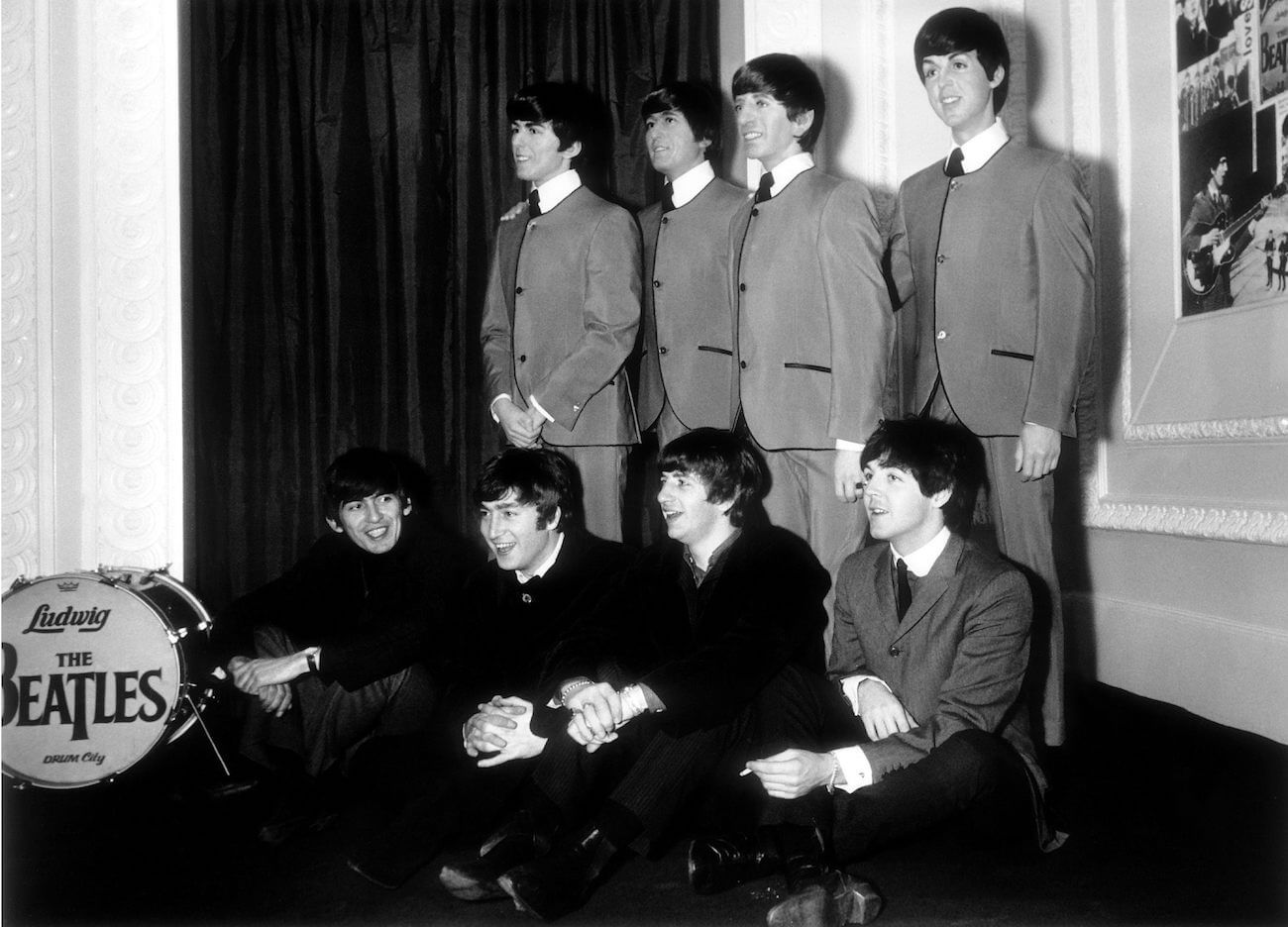 Madame Tussauds wax figures of The Beatles, with the band posing in 1964.