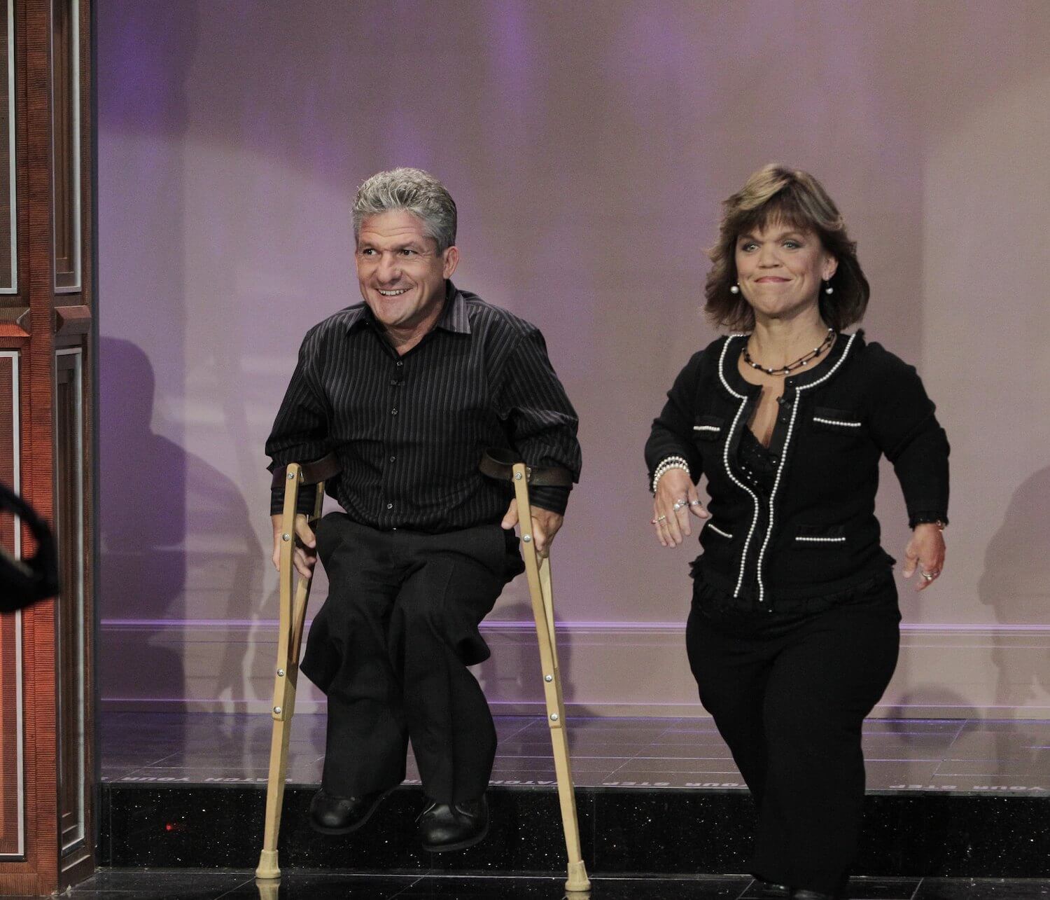 Matt and Amy Roloff from 'Little People, Big World' walking on a stage together