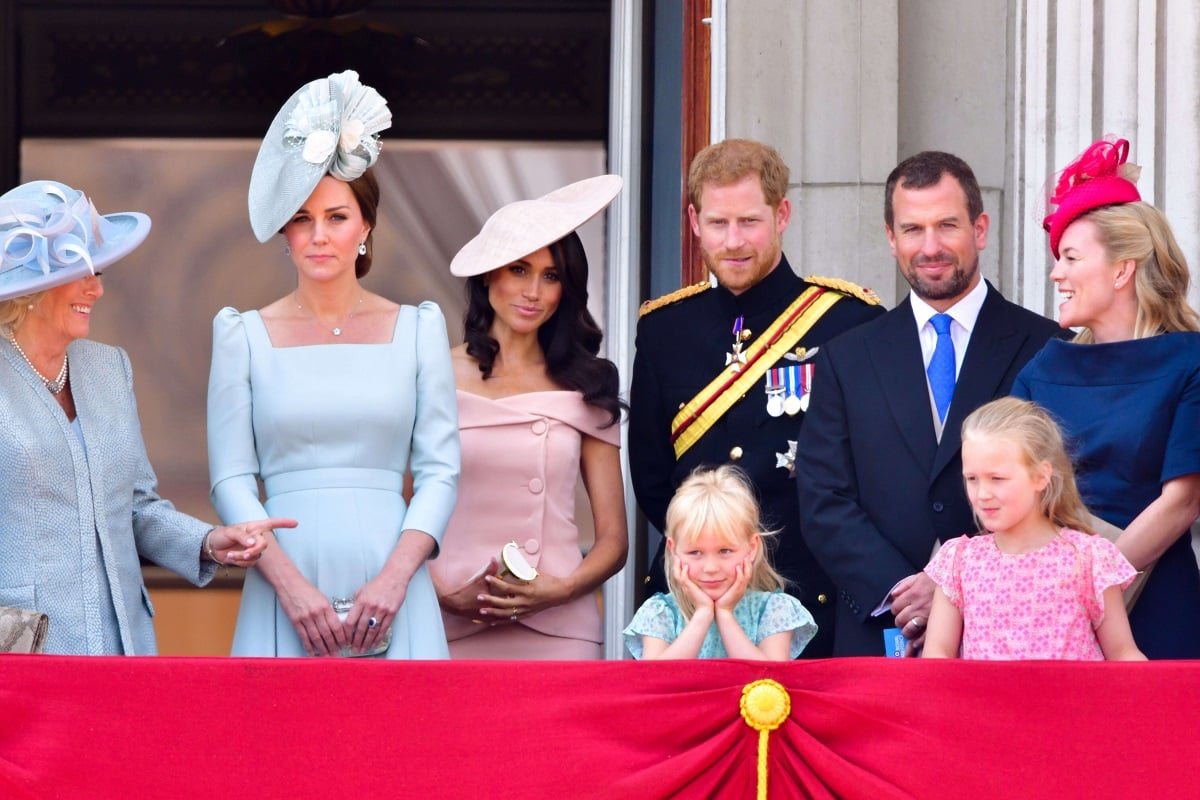 Meghan Markle, Autumn Kelly, along with several members of the royal family standing on the balcony of Buckingham Palace