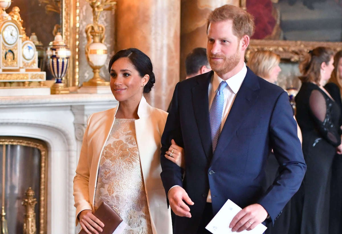 Meghan Markle and Prince Harry, who wanted title announcement to come from Buckingham Palace, walk