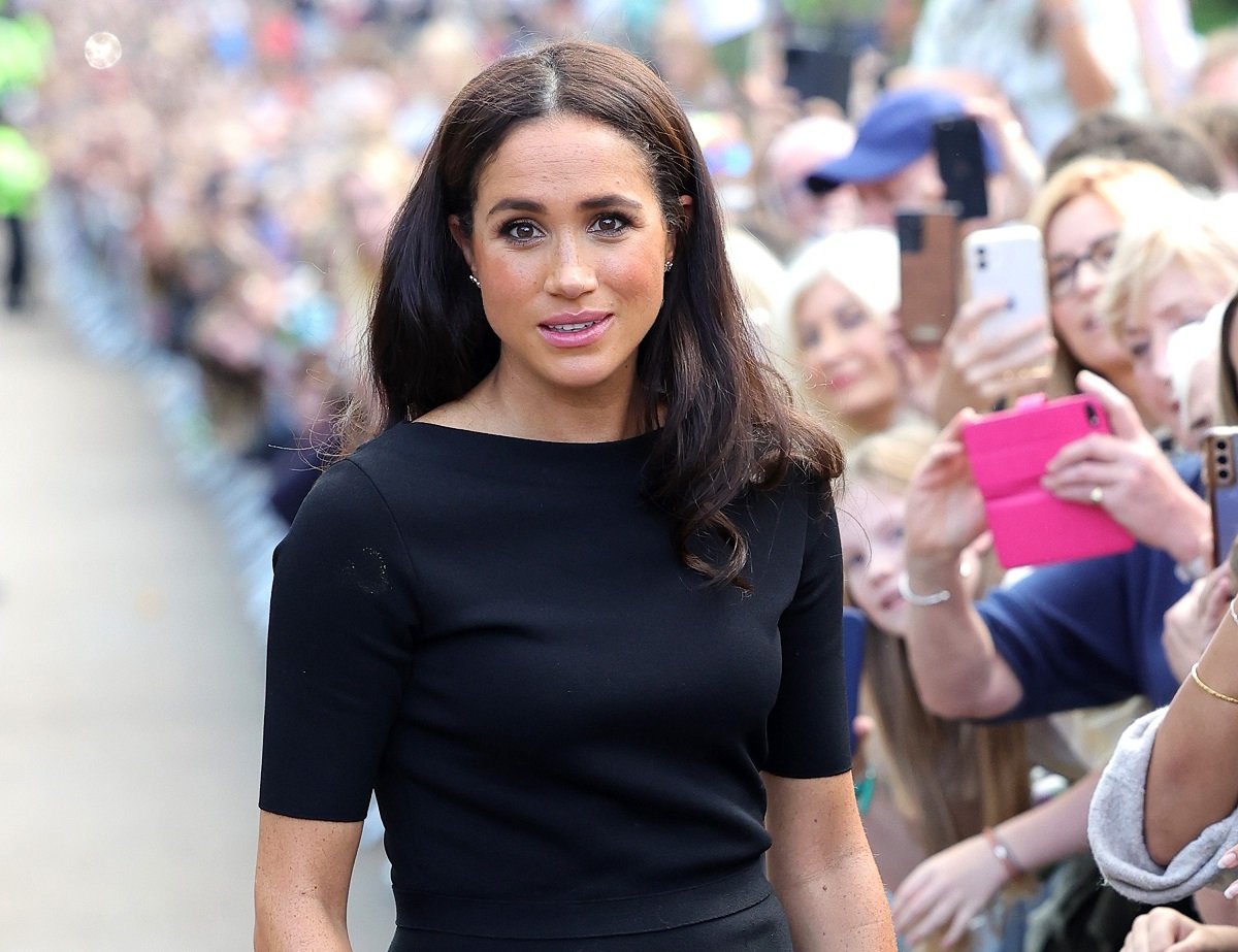 Meghan Markle on the Long Walk at Windsor Castle after viewing flowers and tributes to Queen Elizabeth II