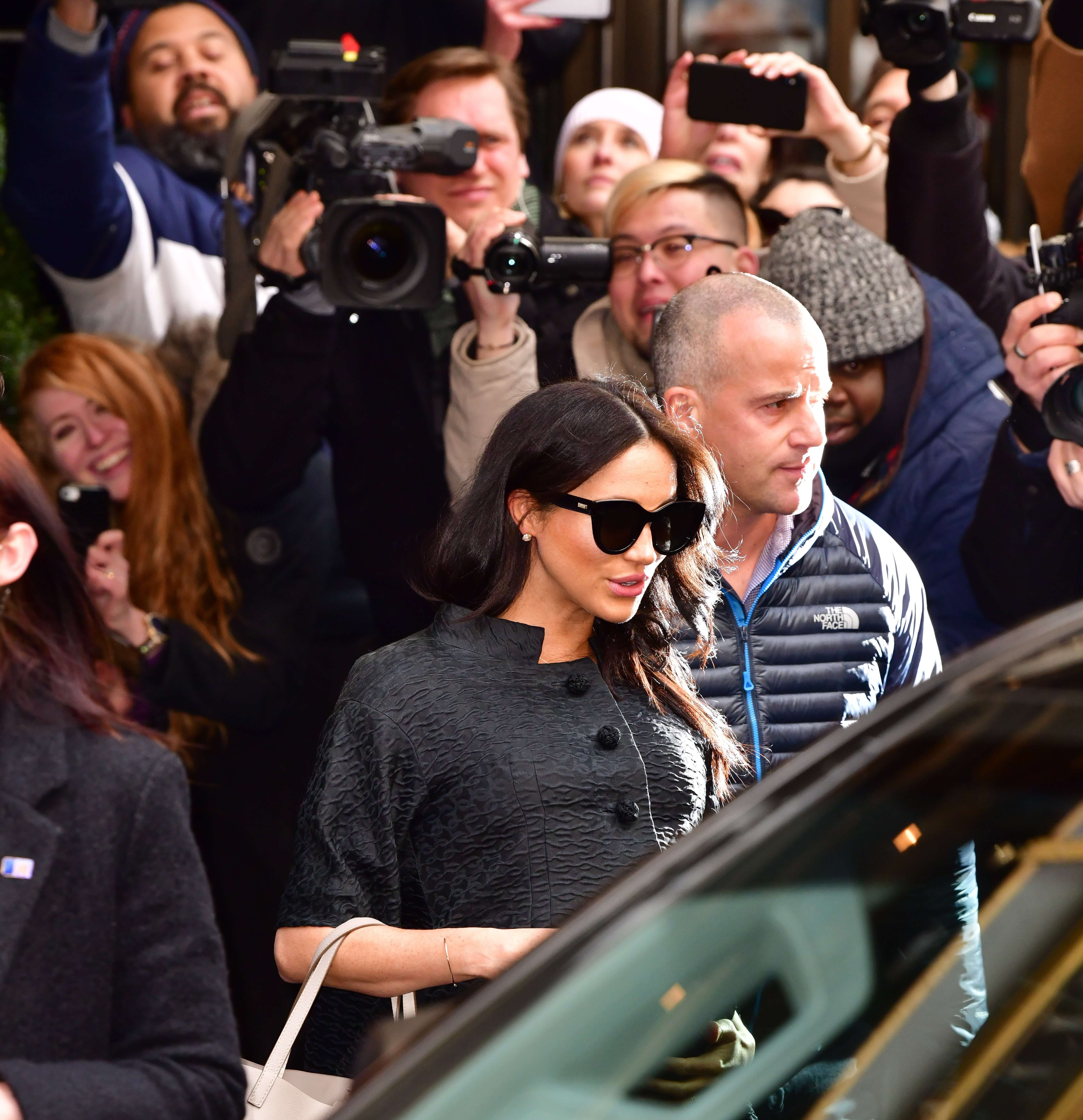 Meghan Markle, whose body language during an appearance with her assistant has been analyzed, seen leaving The Mark Hotel in New York City