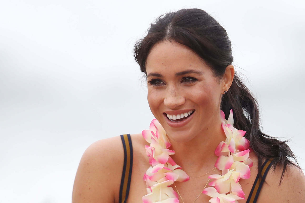 Meghan Markle, Duchess of Sussex, talks to members of OneWave, an awareness group for mental health and well-being at South Bondi Beach on October 19, 2018, in Sydney, Australia.