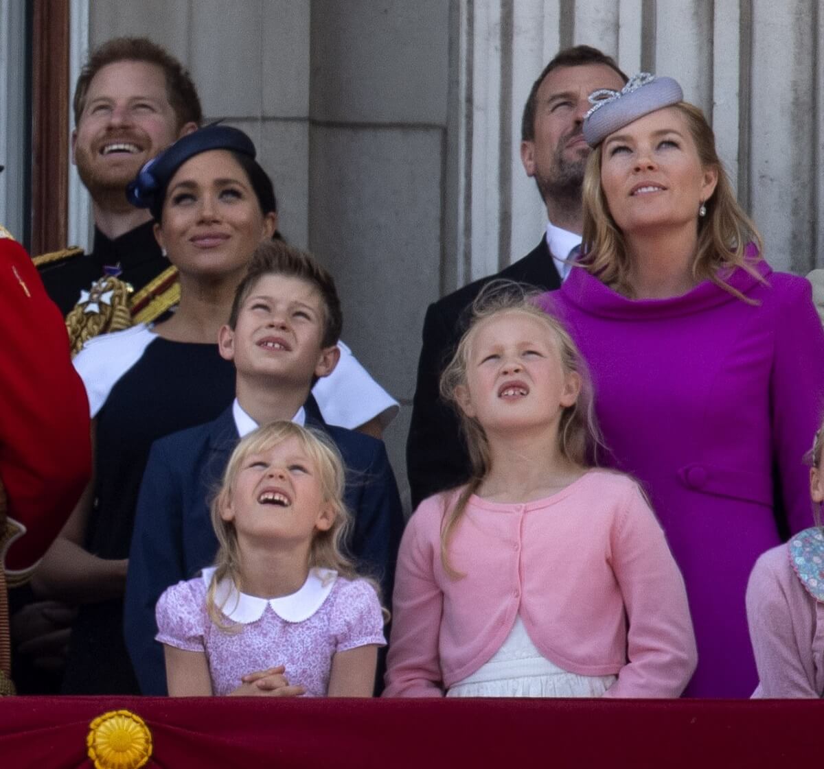 Members of the royal family on the balcony of Buckingham Palace watching a flypast