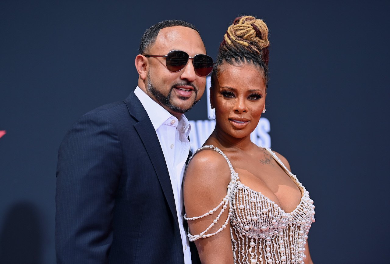 Michael Sterling and Eva Marcille pose together on the red carpet; Marcille filed for divorce