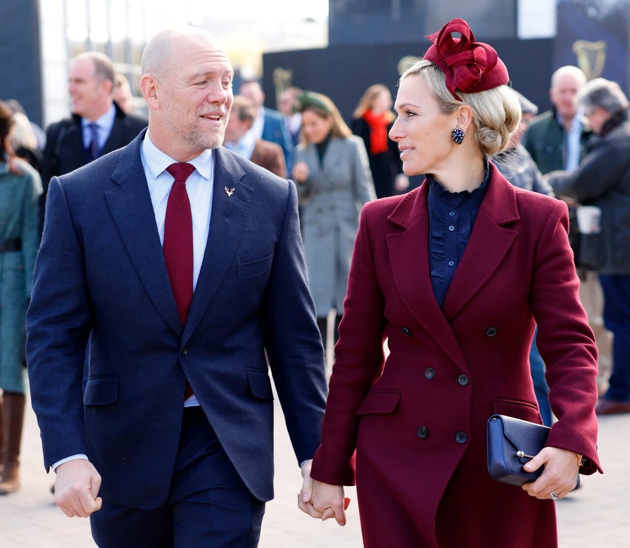 Mike and Zara Tindall hold hands during the Cheltenham Festival.