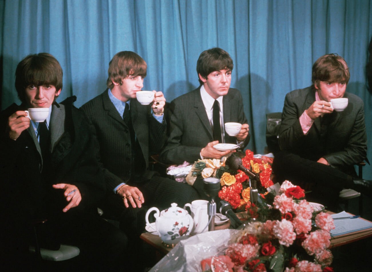 The Beatles drinking tea in 1964.