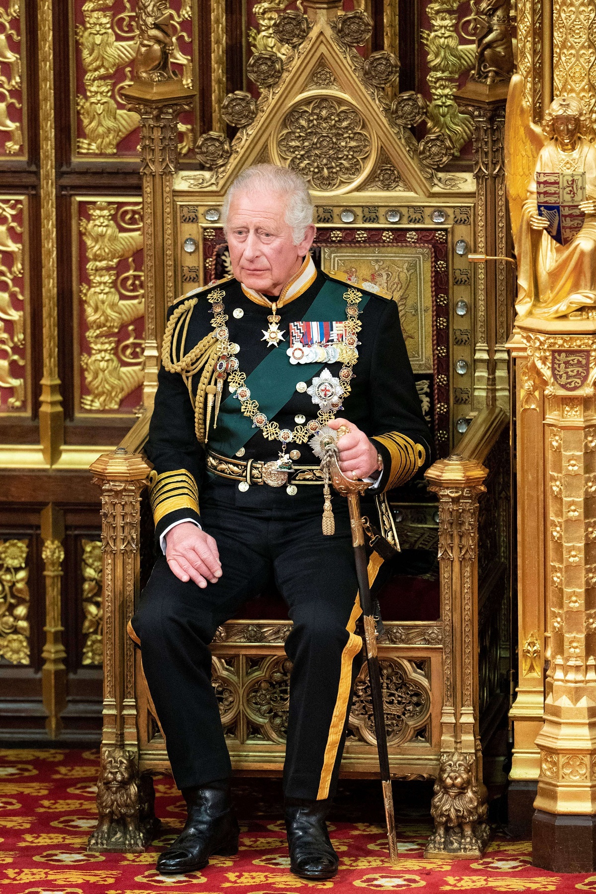 Now-King Charles III sitting in the House of Lords chamber during the State Opening of Parliament