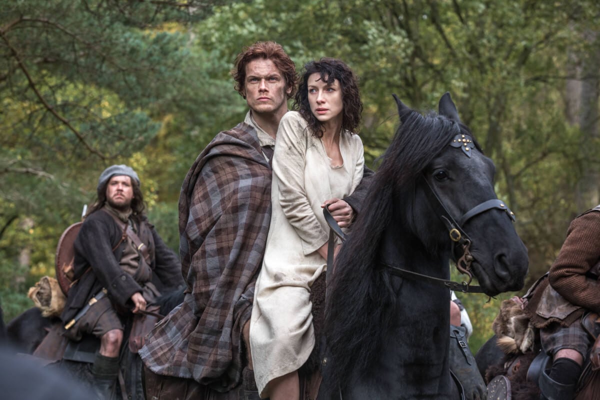 Outlander stars Sam Heughan and Caitriona Balfe in a still image from season 1