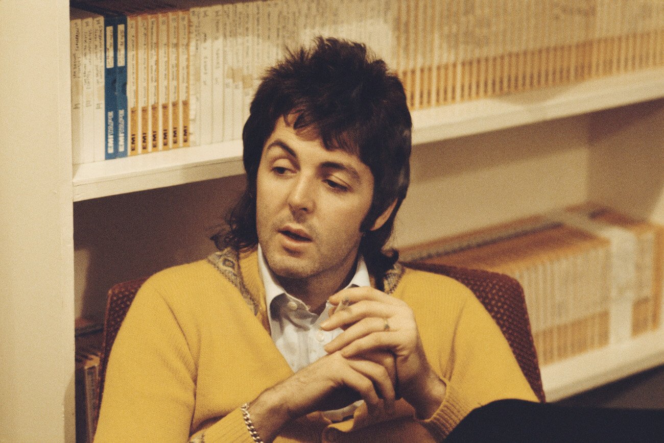Paul McCartney in yellow in an office in 1973.