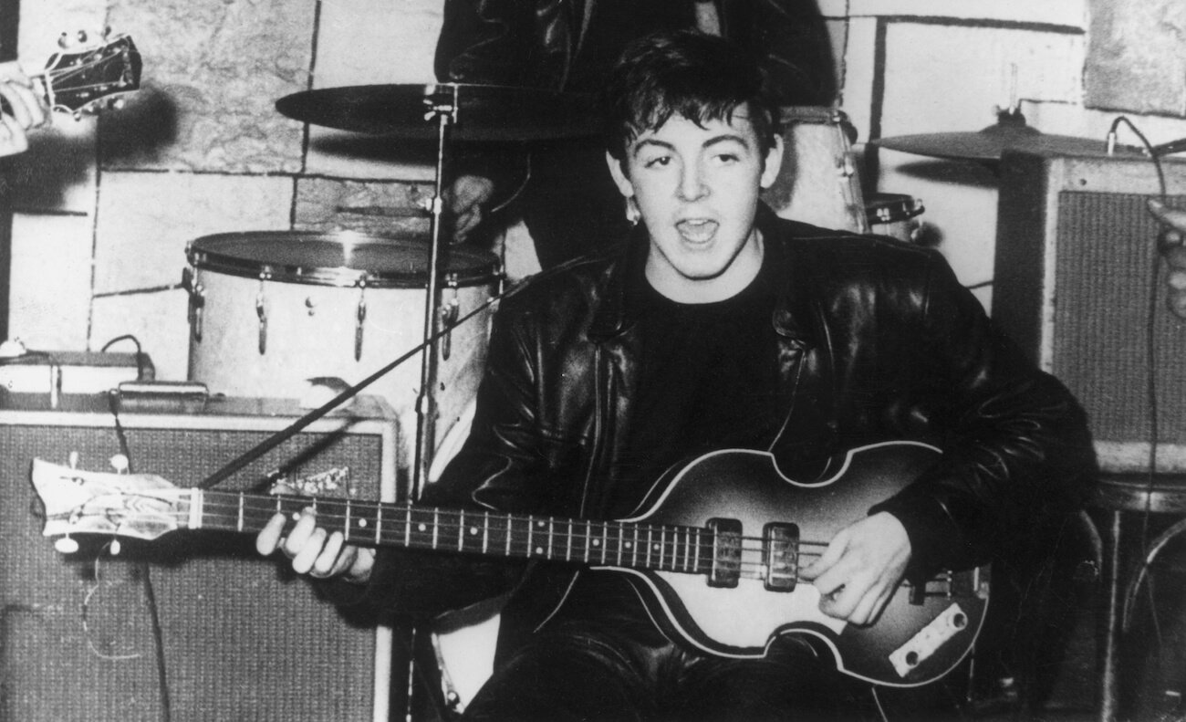 Paul McCartney performing with The Beatles at The Cavern Club in 1960.