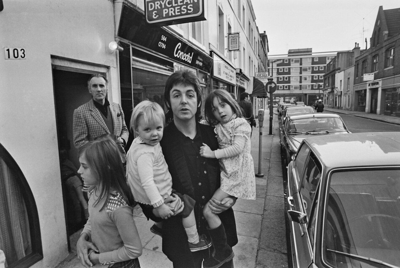 Paul McCartney with his children out on the street in 1973.