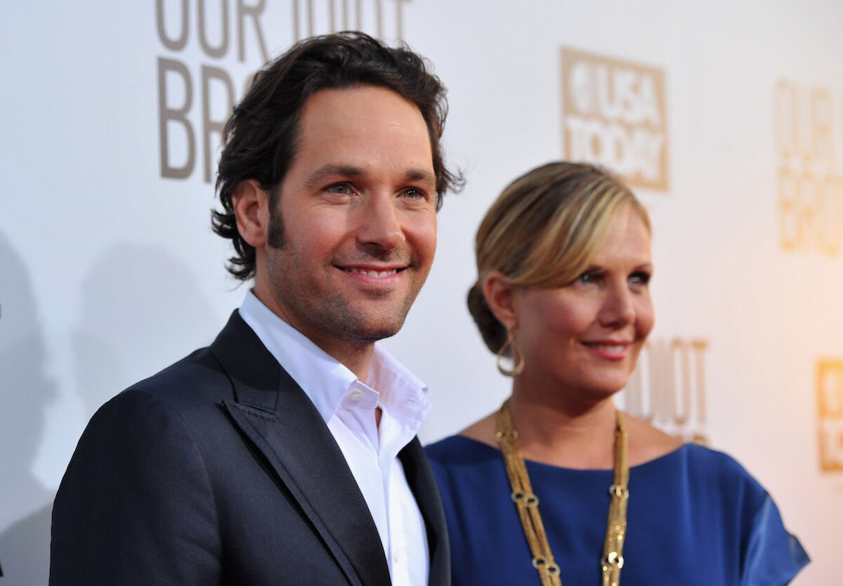 Paul Rudd smiling standing next to his wife Julie Rudd