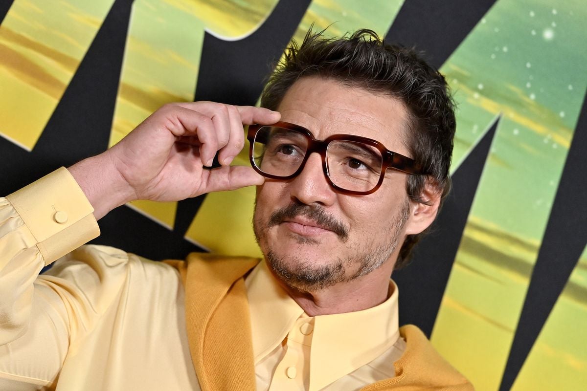 Pedro Pascal adjust his glasses on the red carpet for "The Mandalorian" season 3.