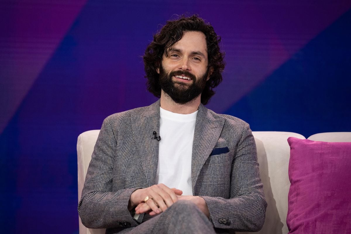 Penn Badgley sitting on a couch on the set of the "Today" show.