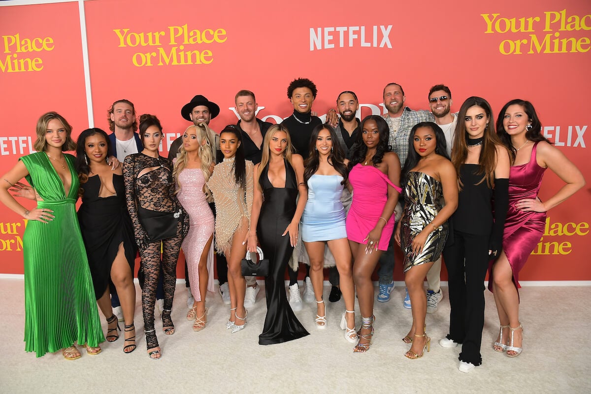 The cast of 'Perfect Match' standing in front of a pink background