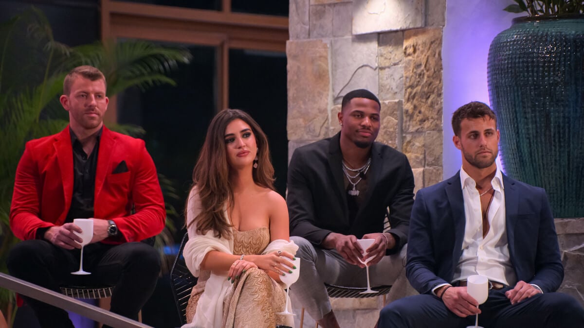 The finale episode of Perfect Match featured a reunion of all the past contestants. Damien Powers, Ines Tazi, Zay Wilson, Mitchell Eason sit at the villa holding wine glasses.