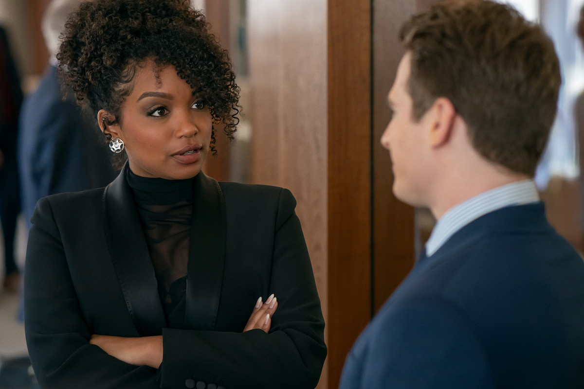 Moriah Brown as KeKe Travis wearing a black suit and speaking to Brayden in 'Power Book II: Ghost'