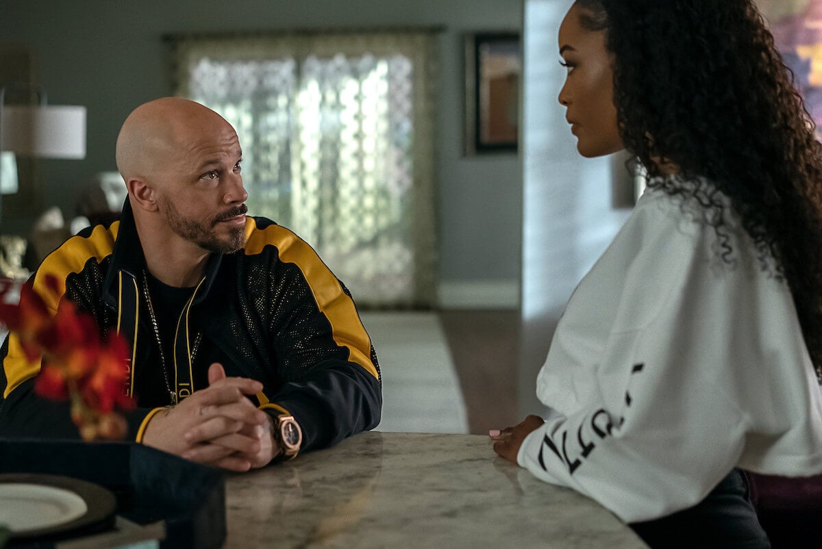 Berto Colon as Lorenzo and Latoya Tonodeo as Diana Tejada speaking in the kitchen in 'Power Book II: Ghost'