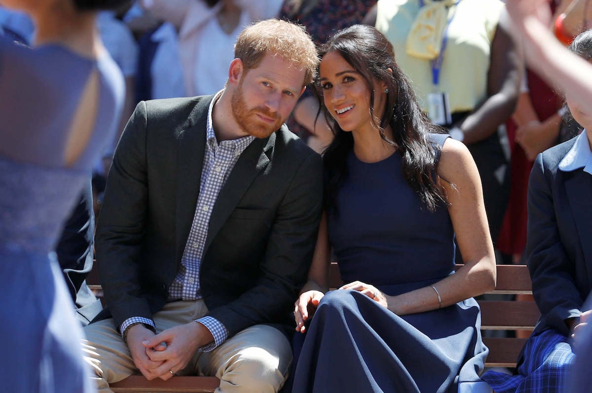 Prince Harry and Meghan Markle, who are in a 'lose-lose situation' regarding King Charles' coronation, look on
