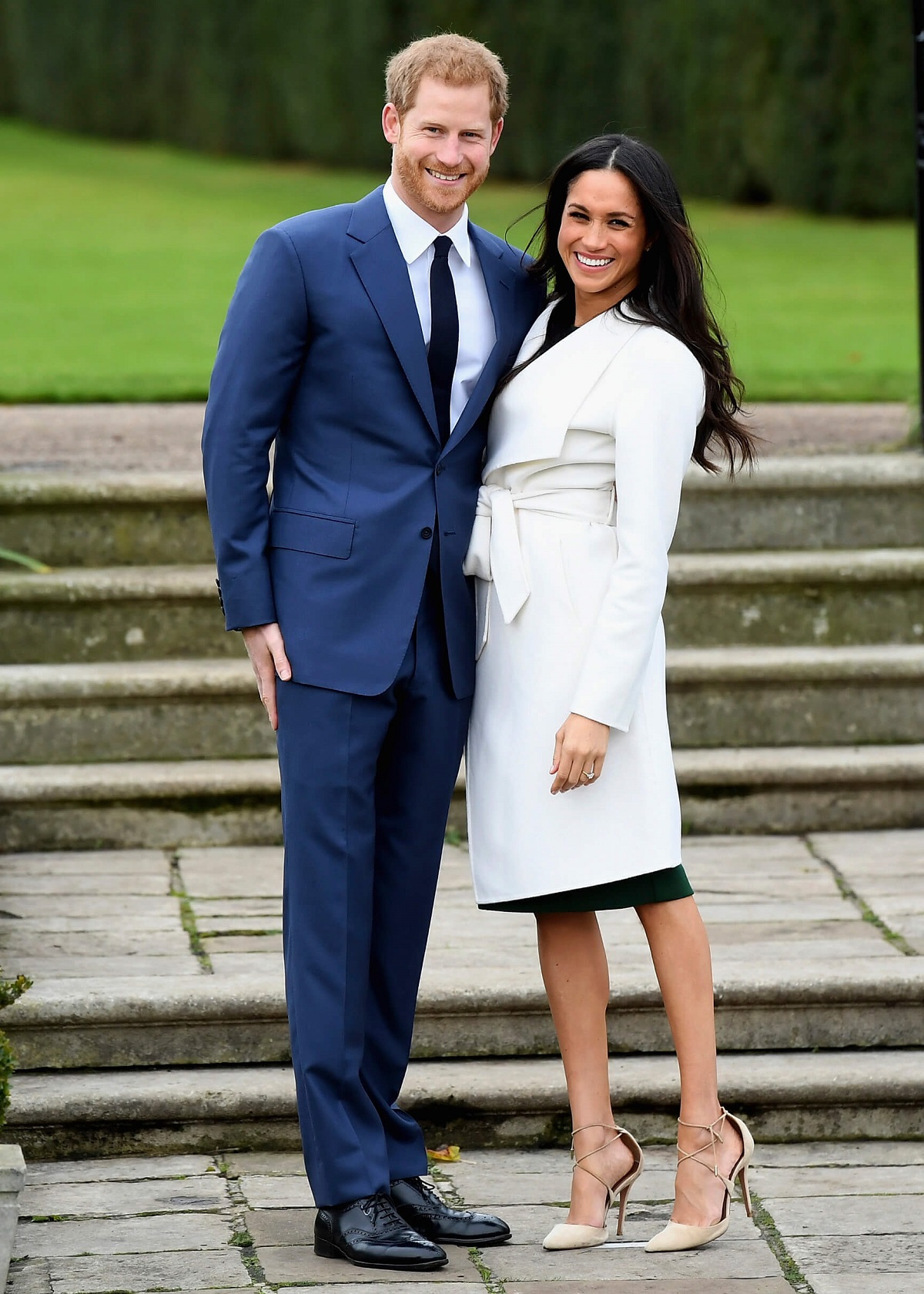 Prince Harry and Meghan Markle smiling at official photocall to announce their engagement