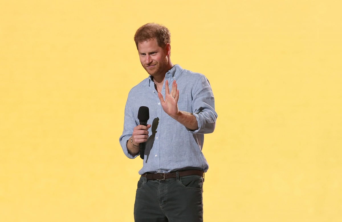 Prince Harry, who a body language expert says using gestures showing he's desperate to be heard, speaks onstage during Global Citizen VAX LIVE in California